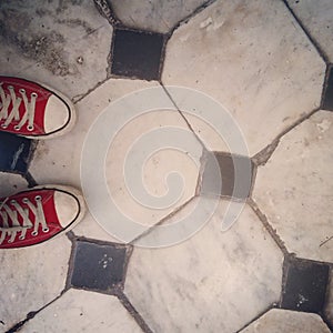 Red Shoes on Black and White Tile Floor