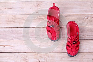 Red shoes sandle on a wooden background