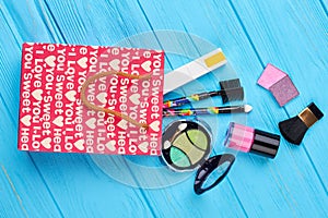 Red shopping bag and cosmetics.