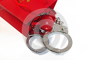 Red shopping bag with gag and handcuff