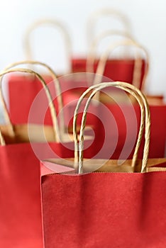Red shopping bags from recycle paper isolated on white background.