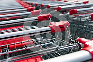 Red shopping carts close up shot