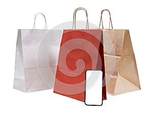 Red Shopping online concept with paper bags on smartphone isolated on white