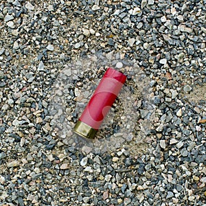 Red shotgun shell that has been fired