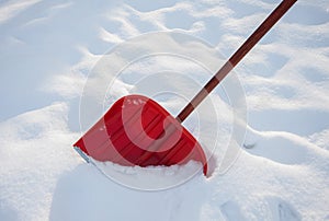 Red shovel for snow