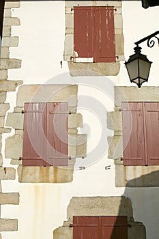 Red shutter windows of Sare, France in Basque Country on Spanish-French border, a hilltop 17th century village surrounded by farm