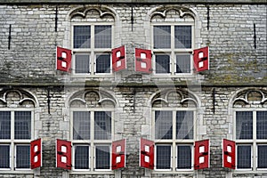 Red shutters at the gothic city hall Gouda