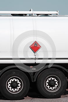 Red sign on fuel tanker truck