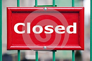 Red sign with the word Closed