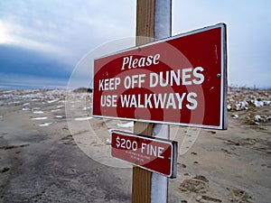 A Sign Asking People To Keep Off The Dunes