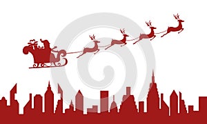 Red Silhouette. Santa claus flying over a city with reindeer sleigh.