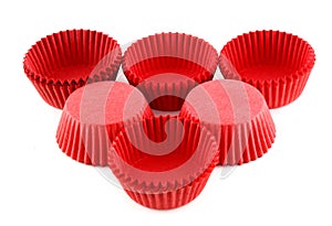 Red silicone form for cooking muffin and cupcake on white background. Molds for sweet and delicious muffins