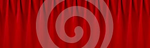 Red silk curtains with smooth waves as rich abstract theatre background. Banner for design of website, header, cover.