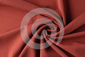 Red silk luxury drapery fabric texture background closeup