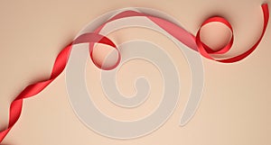 red silk ribbon twisted on a beige background, festive backdrop