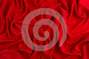 Red silk wavy background. Passion backdrop for Valentines day.