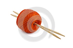 Red skein with knitting needles