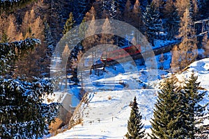 Red ski funicular in the Swiss Alps in winter resort Davos, Switzerland