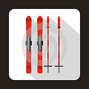 Red skis and ski poles icon, flat style