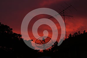 Red sky at night and dish satellite