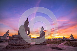 Red sky over buddha statues