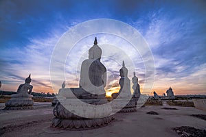 Red sky over buddha statues