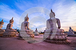 Red sky over buddha statues