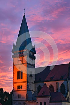 The red sky over Church of st. Egidius on Town hall square in Bardejov town after summer sunset