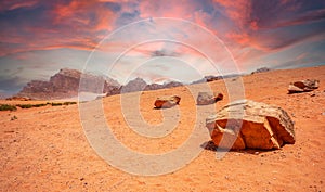 Red sky, sands and stones of Wadi Rum desert