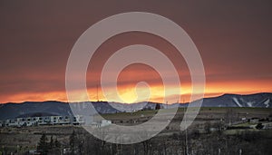 Red sky sunset. Beautiful colorful sunset over Graniar - Banska Bystrica, Slovakia, Central Europe. Winter snowy mountains and