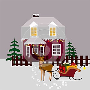 Red sleigh with gifts and a deer, footprints in the white snow a festive Christmas two-story house with