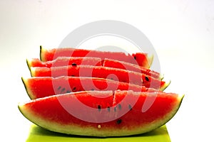 Red sliced melon on the green box
