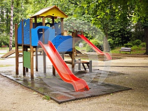 Red slides in a playground for children