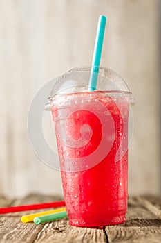 Red Slushie Drink in Plastic Cup with Straws