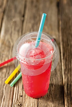 Red Slushie Drink in Plastic Cup with Straws