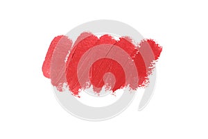 Red smear of lipstick isolated on white background, close-up, top view