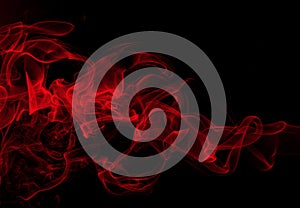 Red smoke abstract on black background, fire design, darkness concept