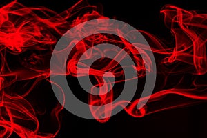 Red smoke abstract on black background, fire design and darkness concept