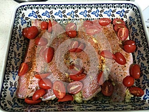 Red snapper fillets and cherry tomatoes