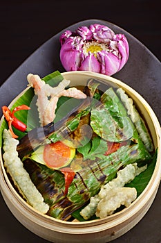Red snapper fish fillet wraped in banana leaf