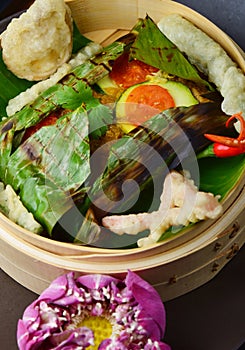 Red snapper fish fillet wraped in banana leaf