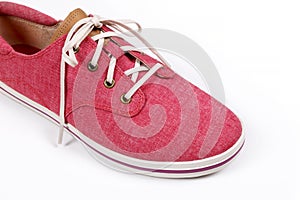 Red sneakers isolated on a white background.