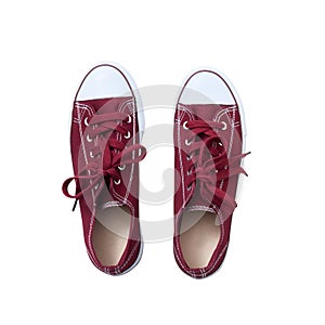 Red sneakers isolated on white background, top view close up