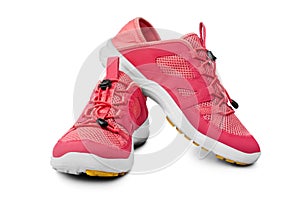 Red sneakers white background isolated close up front side view, pink sport sneaker shoes, pair running gumshoes, fitness boots