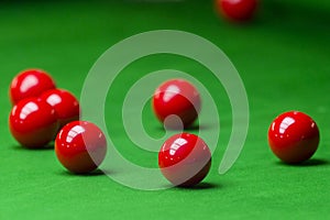 Red snooker ball on the green snooker table at snooker club