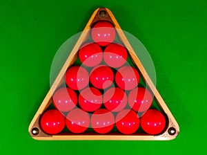 Red snooker balls in triangle