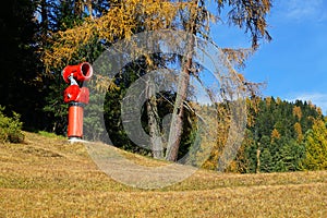 Red snow cannon in Odle group area, Dolomites.