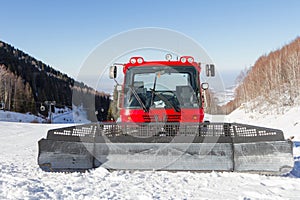 Red snowcat in mountains of Kazakhstan