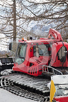 Red snowcat ratrack mountain landscape