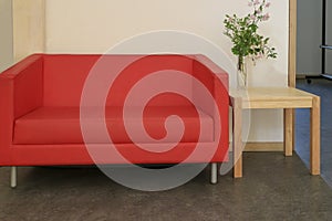 Red sofa and small wooden table